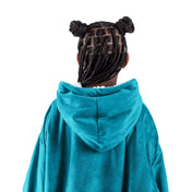 A child with a wearable blanket on