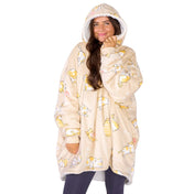 An adult with a sherpa wearable blanket on
