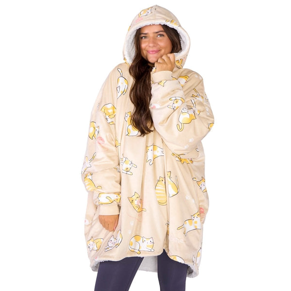 An adult with a sherpa wearable blanket on