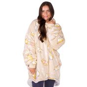 An adult with a hooded wearable blanket on