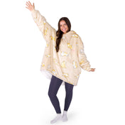 An adult with a sherpa wearable blanket on