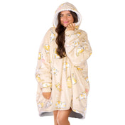 An adult with a sherpa wearable blanket on