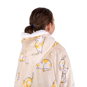 A child with a sherpa wearable blanket on