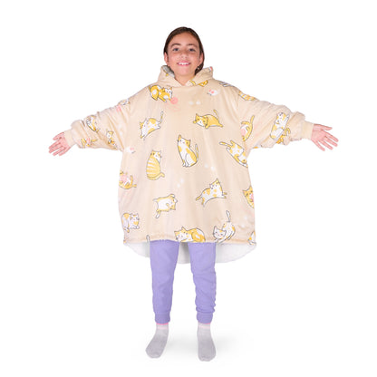 A child wearing a hooded blanket