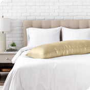 A silk body pillowcase on a pillow resting on a bed