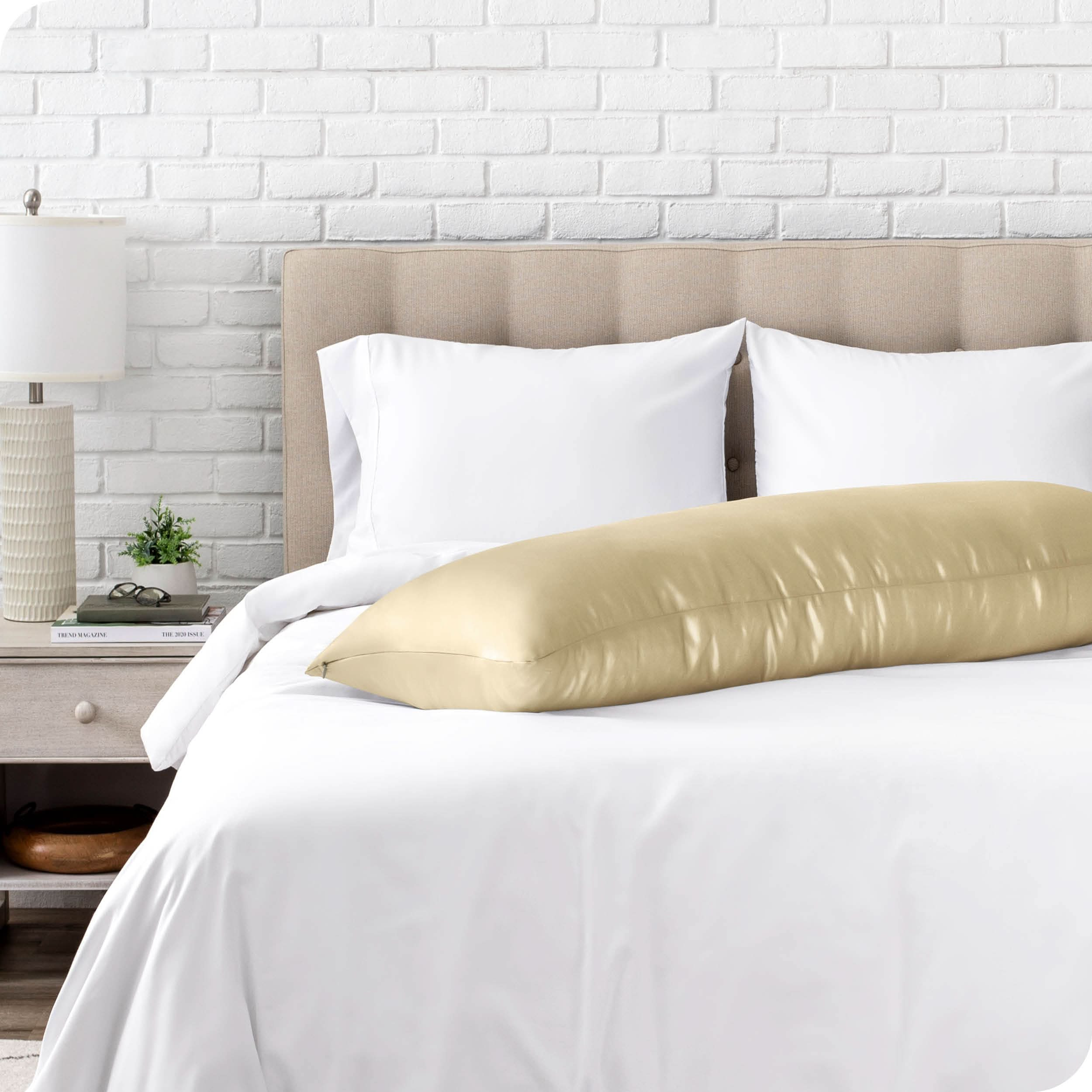 A silk body pillowcase on a pillow resting on a bed