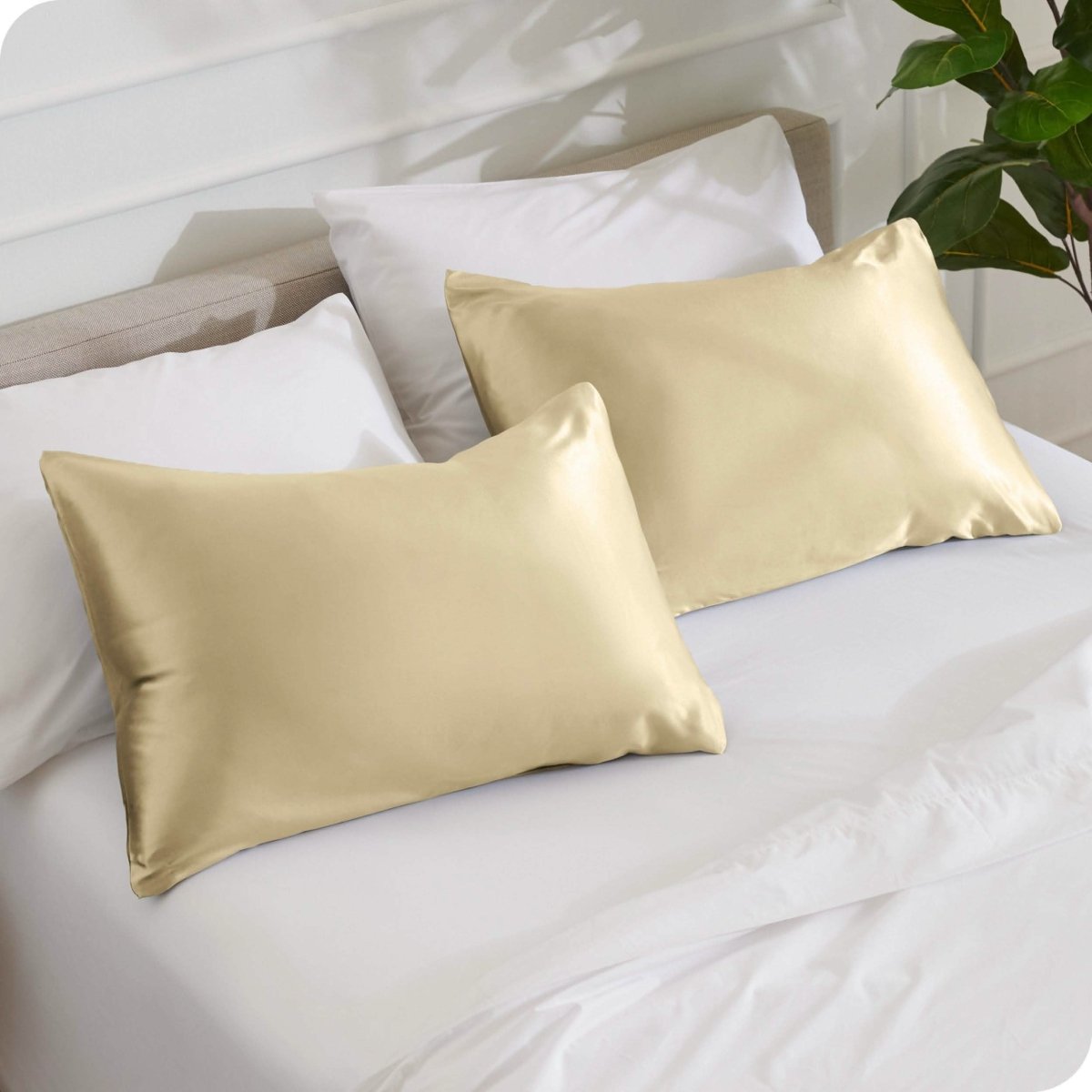 2 mulberry silk pillowcases on pillows set on a bed
