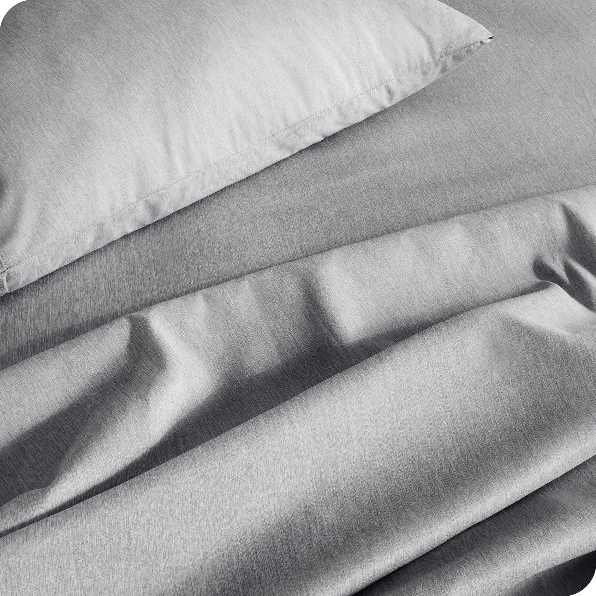 Close up of a heather sheet set on a bed