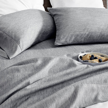 Ultra soft sheet set with a bowl of food on a bed