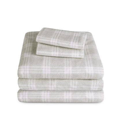 Stack of flannel sheets and pillowcases on a white background