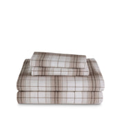 Stack of flannel sheets and pillowcases on a white background