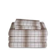 Stack of flannel sheets and pillowcases on a white background