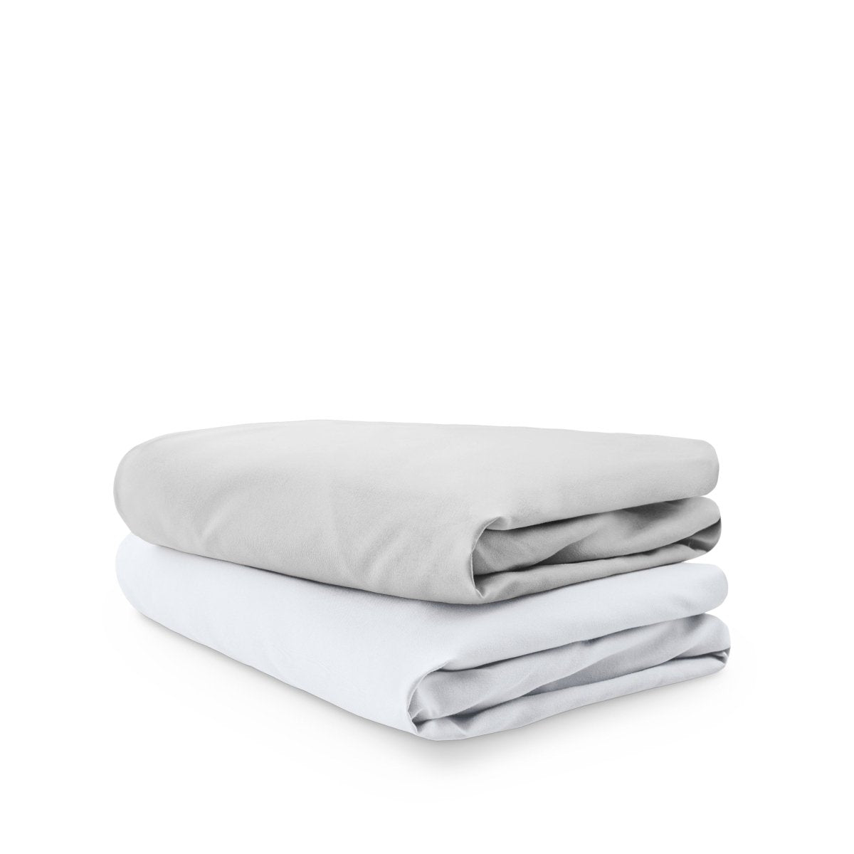 Stack of folded crib sheets on a white background
