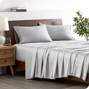 A stylish bed with bamboo sheets and pillowcases, showcasing a sophisticated and elegant bedroom setting.