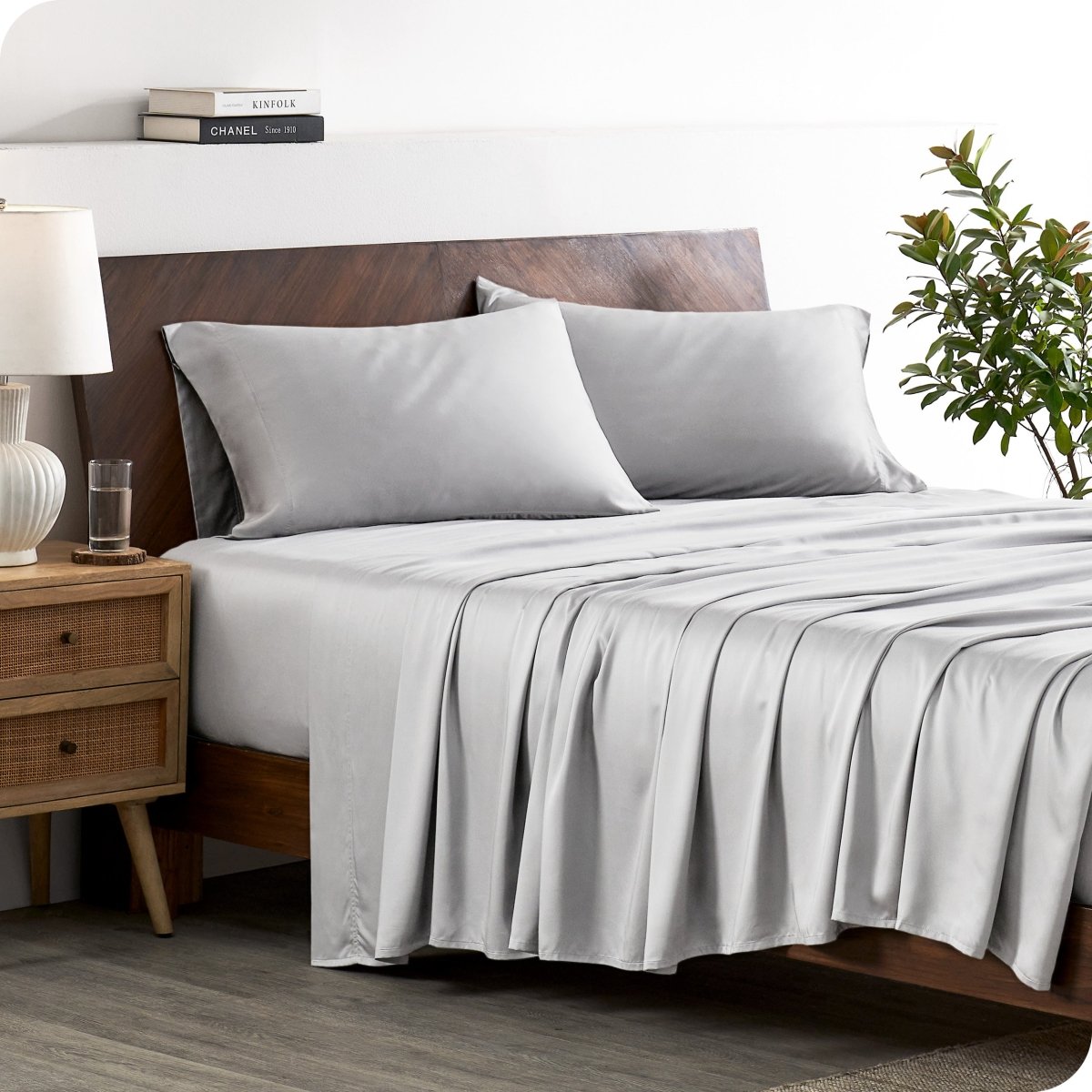 A stylish bed with bamboo sheets and pillowcases, showcasing a sophisticated and elegant bedroom setting.