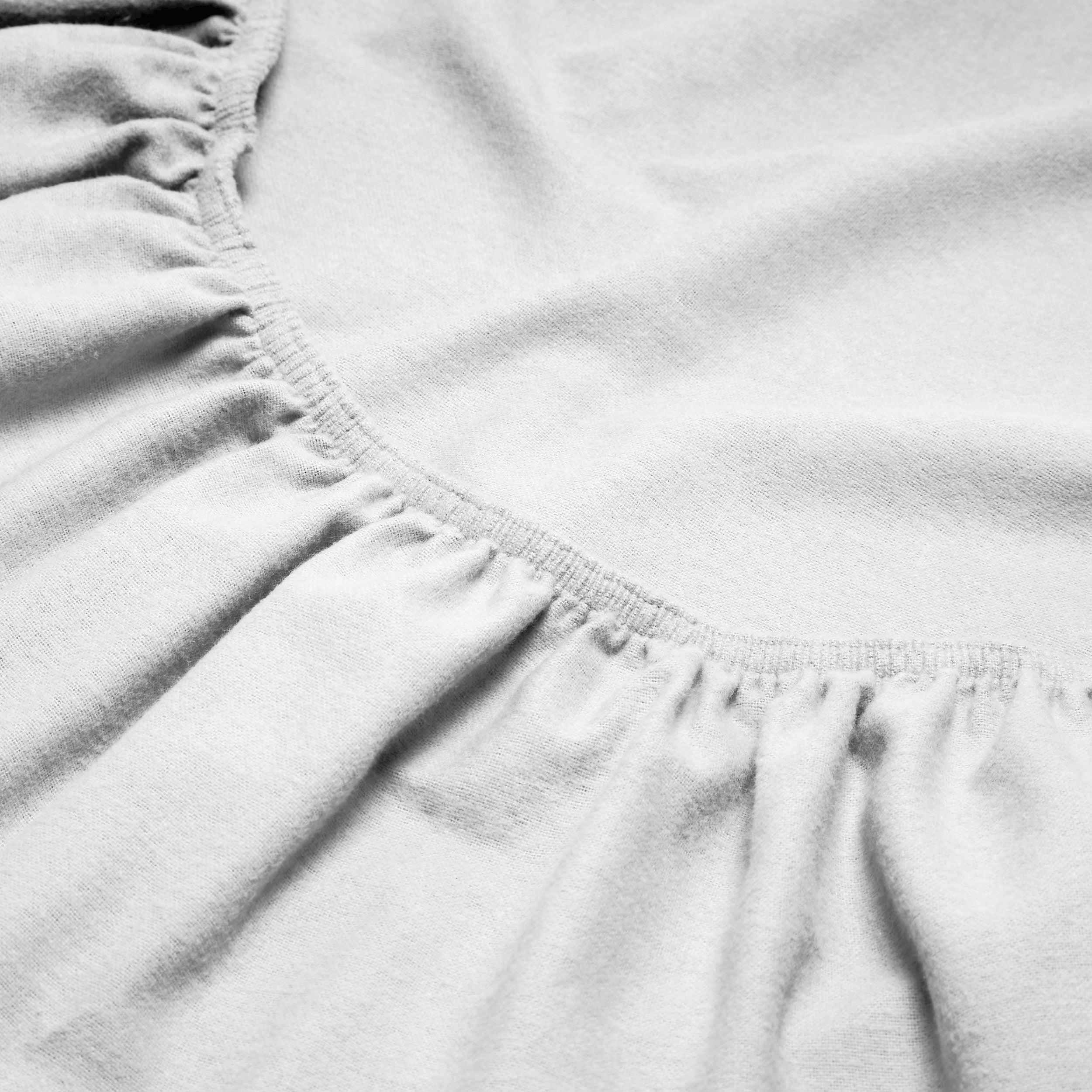 Close-up of a flannel fitted sheet with gathered elastic