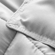 Close-up of comforter fabric with stitching detail