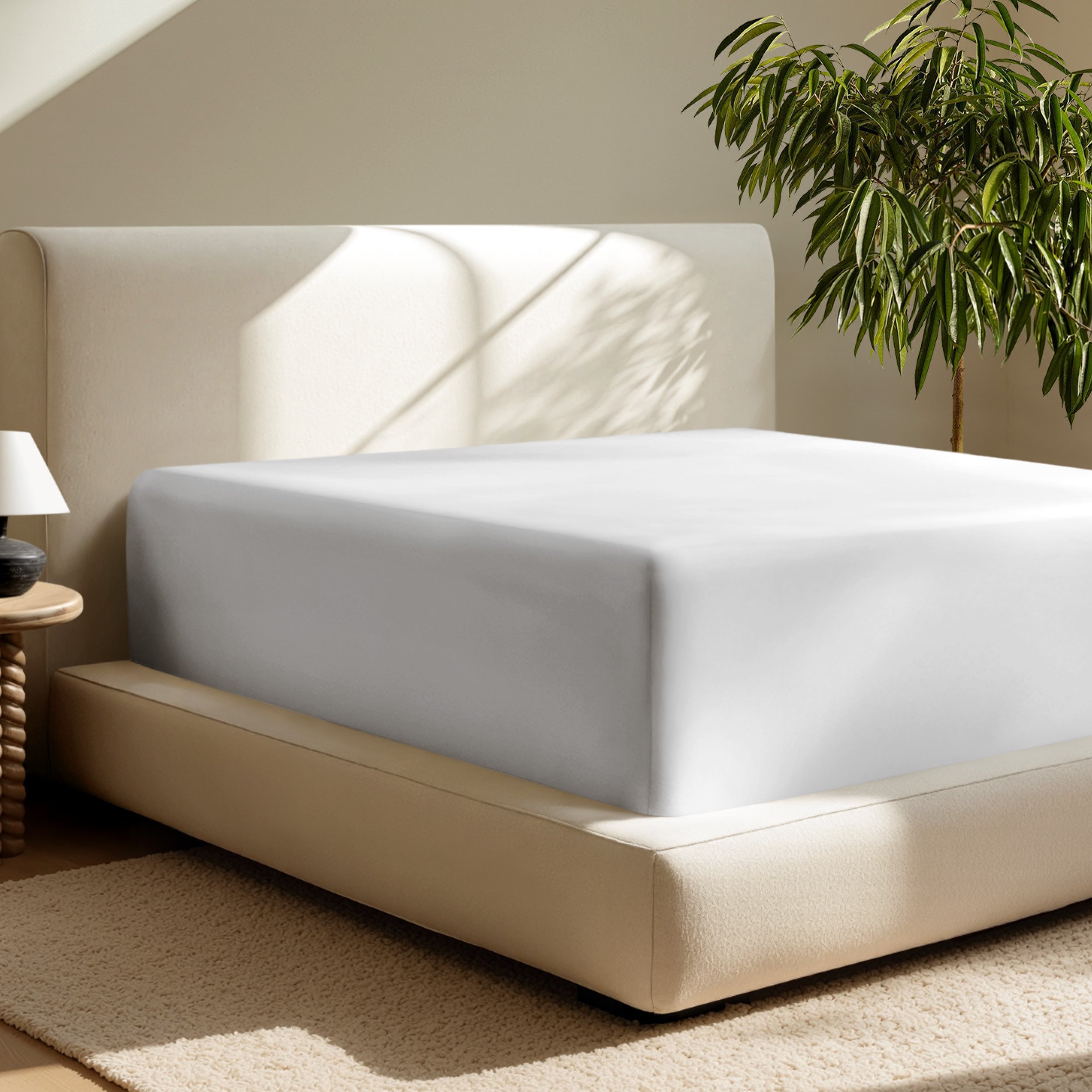 A deep pocket fitted sheet on a mattress