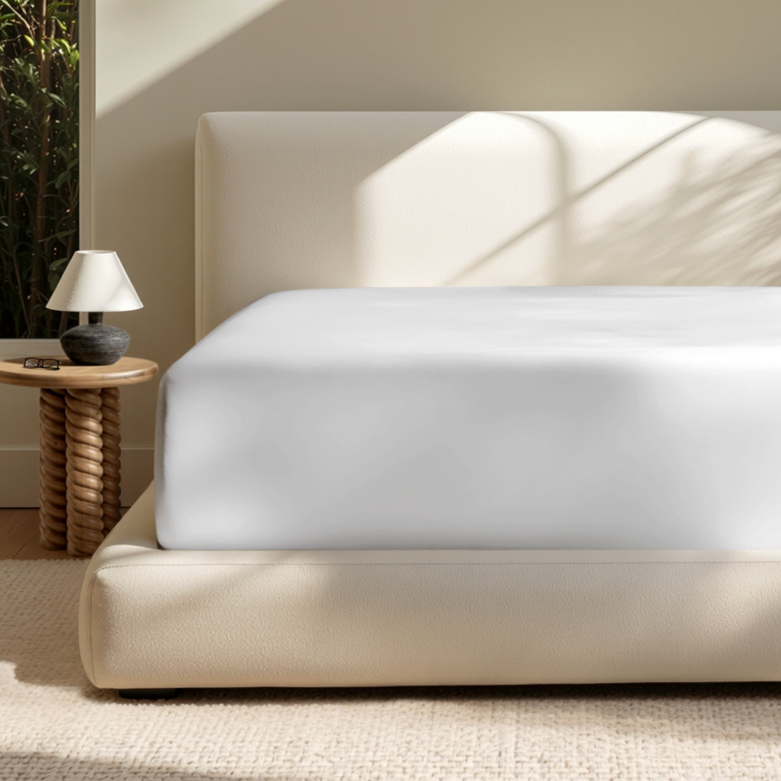 A deep pocket mattress with a fitted sheet on it