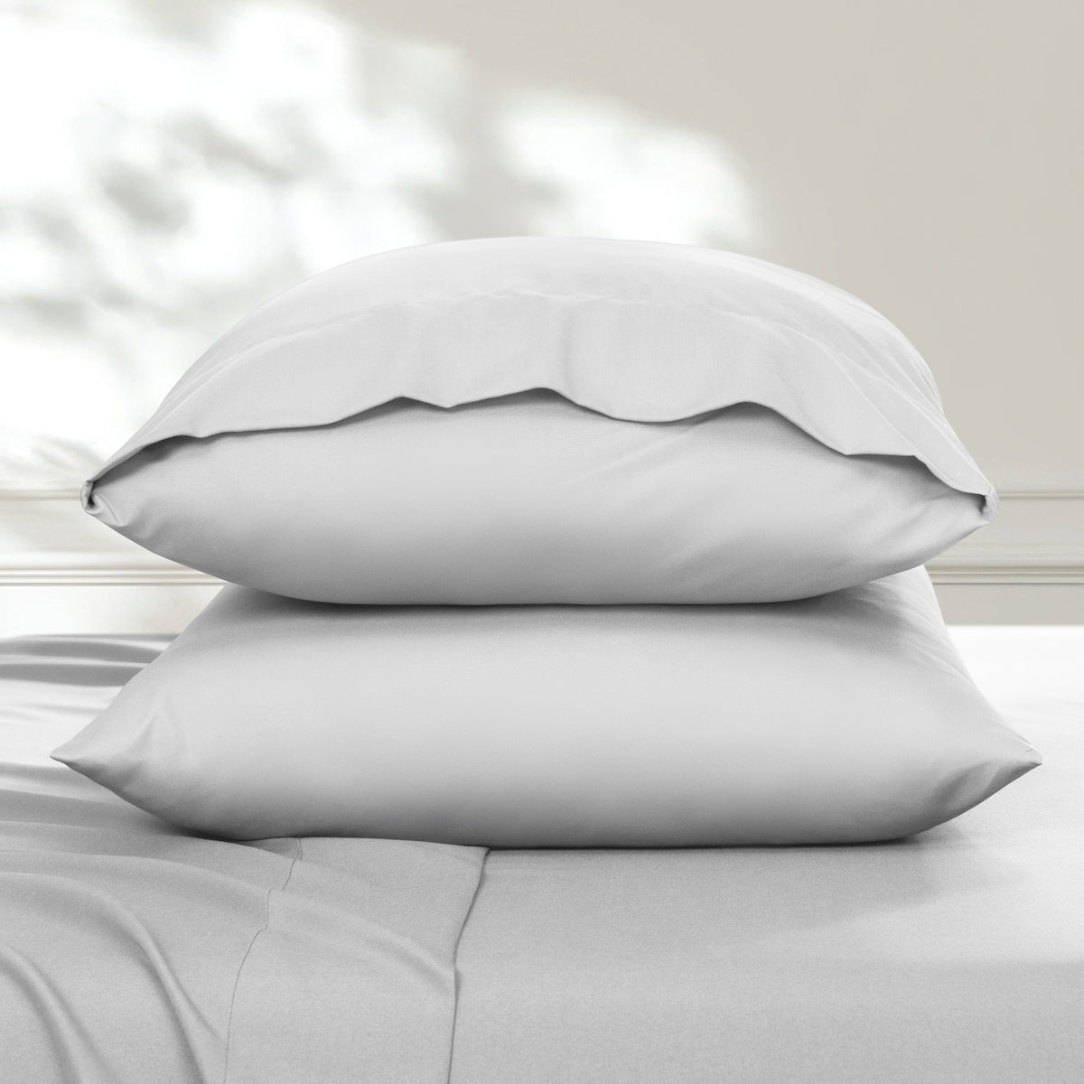 2 pillowcases on pillows