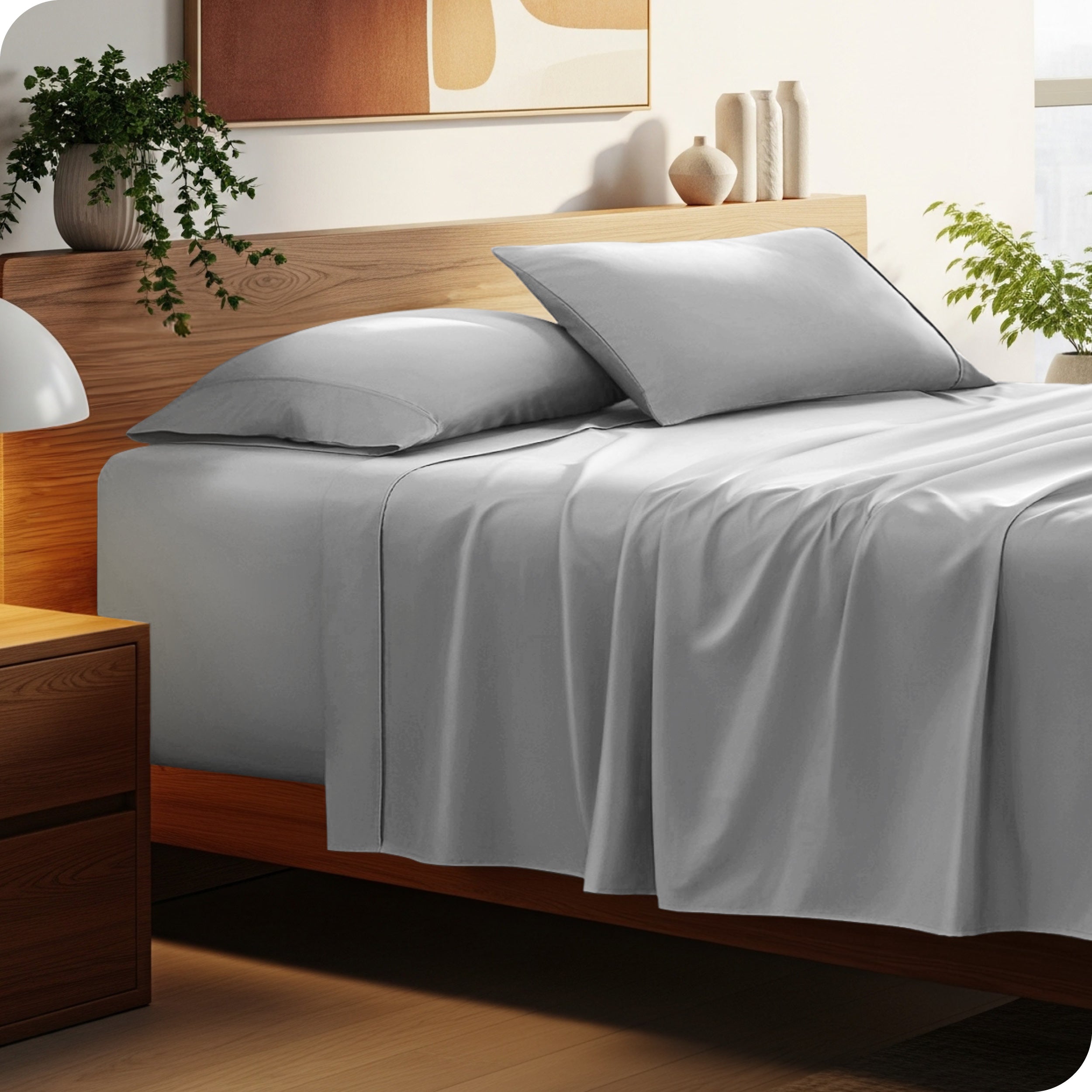 Bed with microfiber bedding and wooden headboard in a bedroom setting
