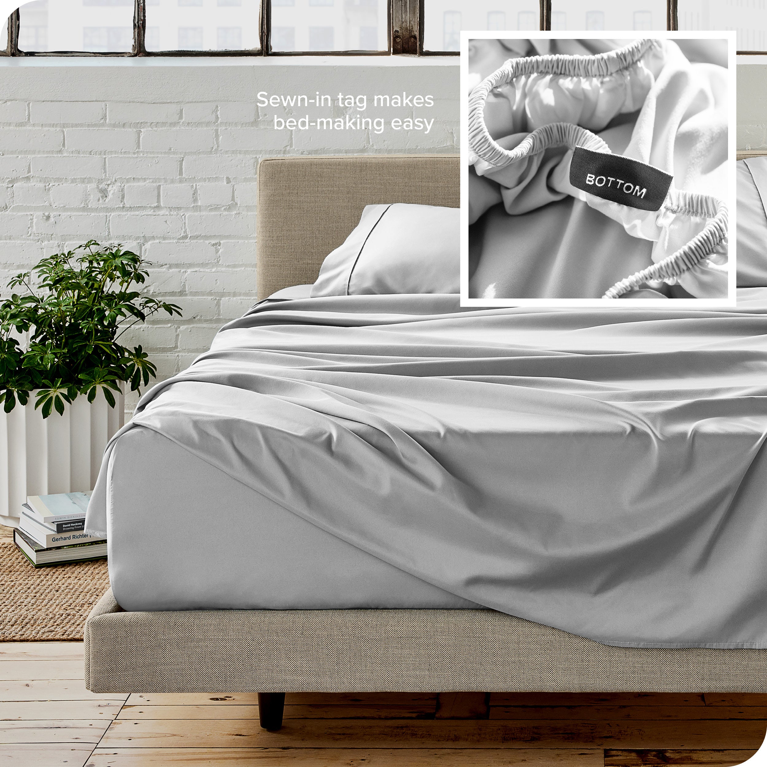 Close up of sewn in tag and matching sheets on a bed