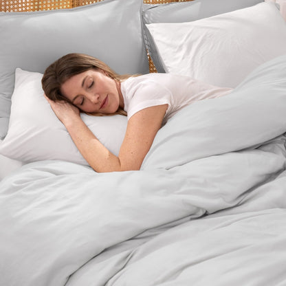 Woman sleeping peacefully under organic jersey bedding