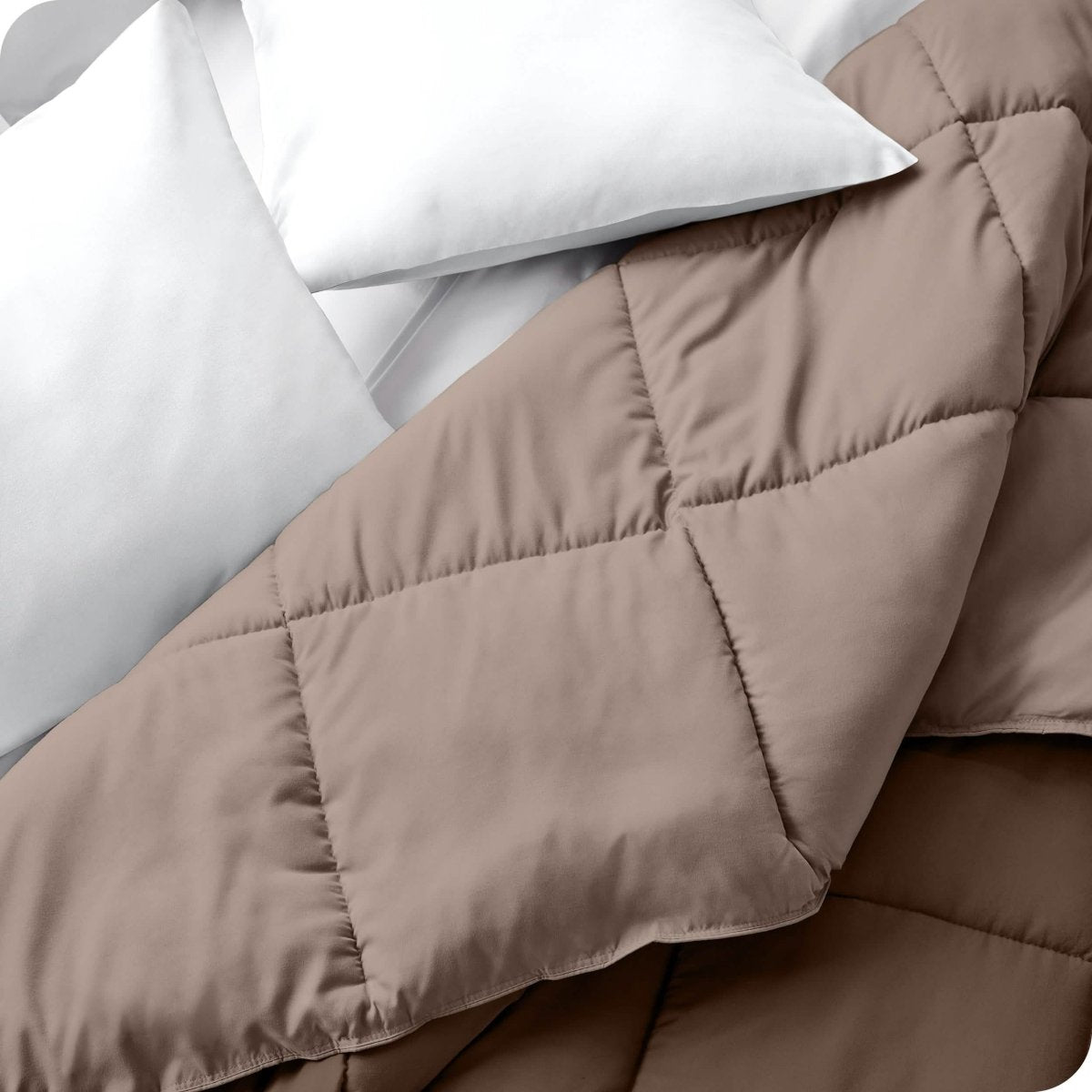 Close up of a comforter folded back to show the different colored sides