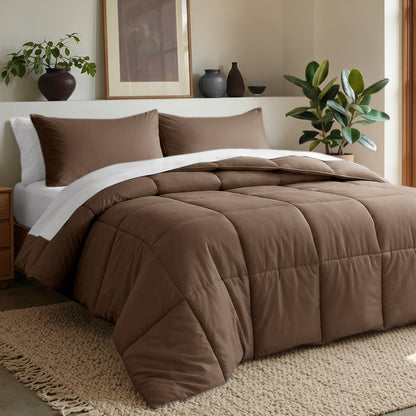 Comforter set on a bed in a bedroom with plants and decor.