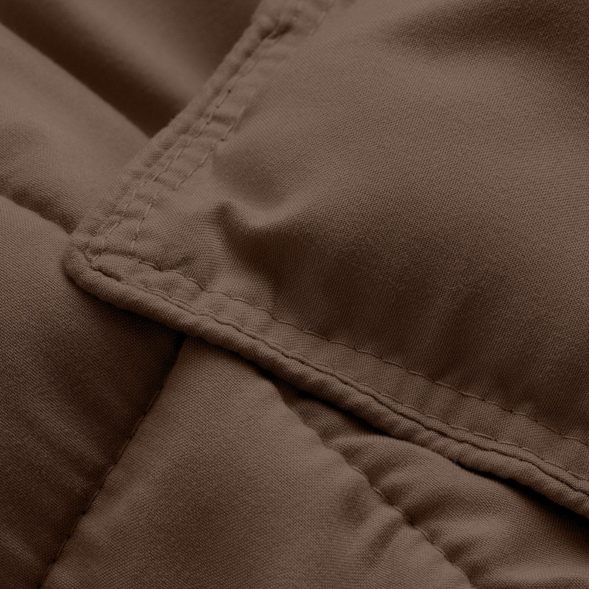 Close-up of comforter fabric with stitching detail