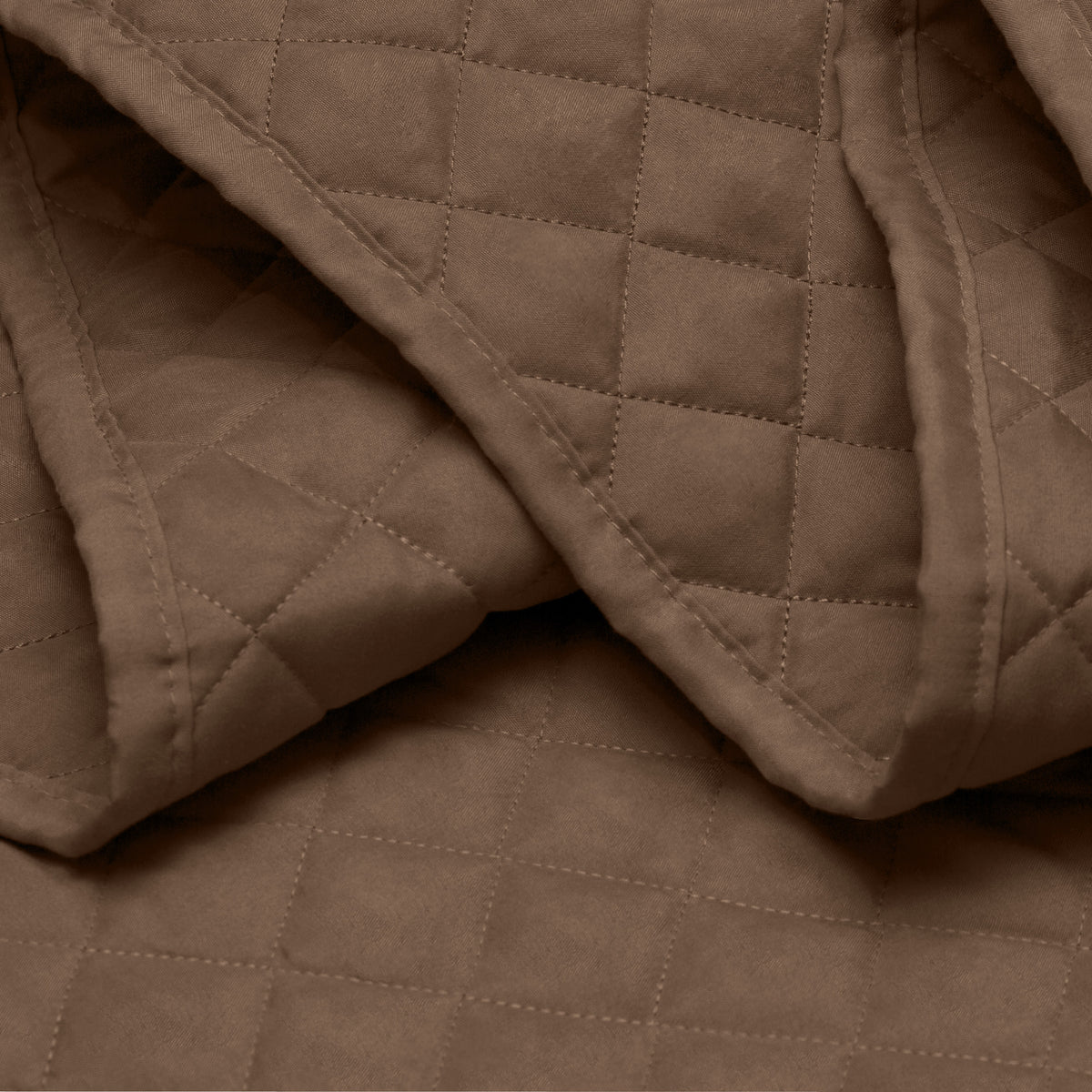 Close in view showing texture of coverlet set fabric