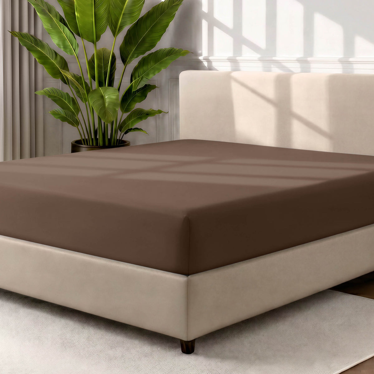 Ultra soft fitted sheet on a mattress with the sun shining into the bedroom
