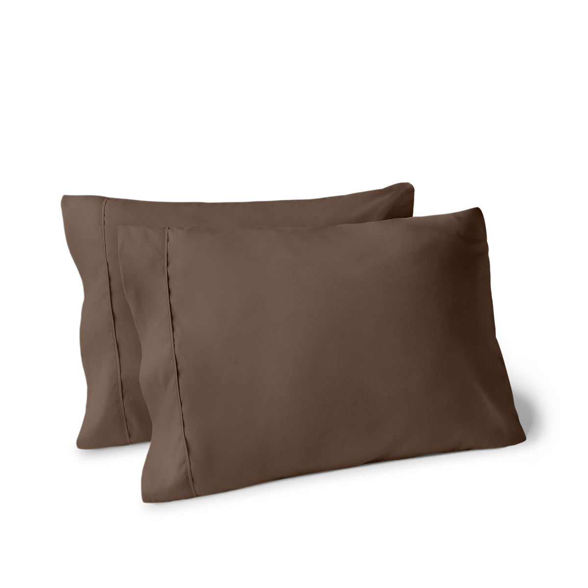 Two pillows on a white background with pillowcases on them