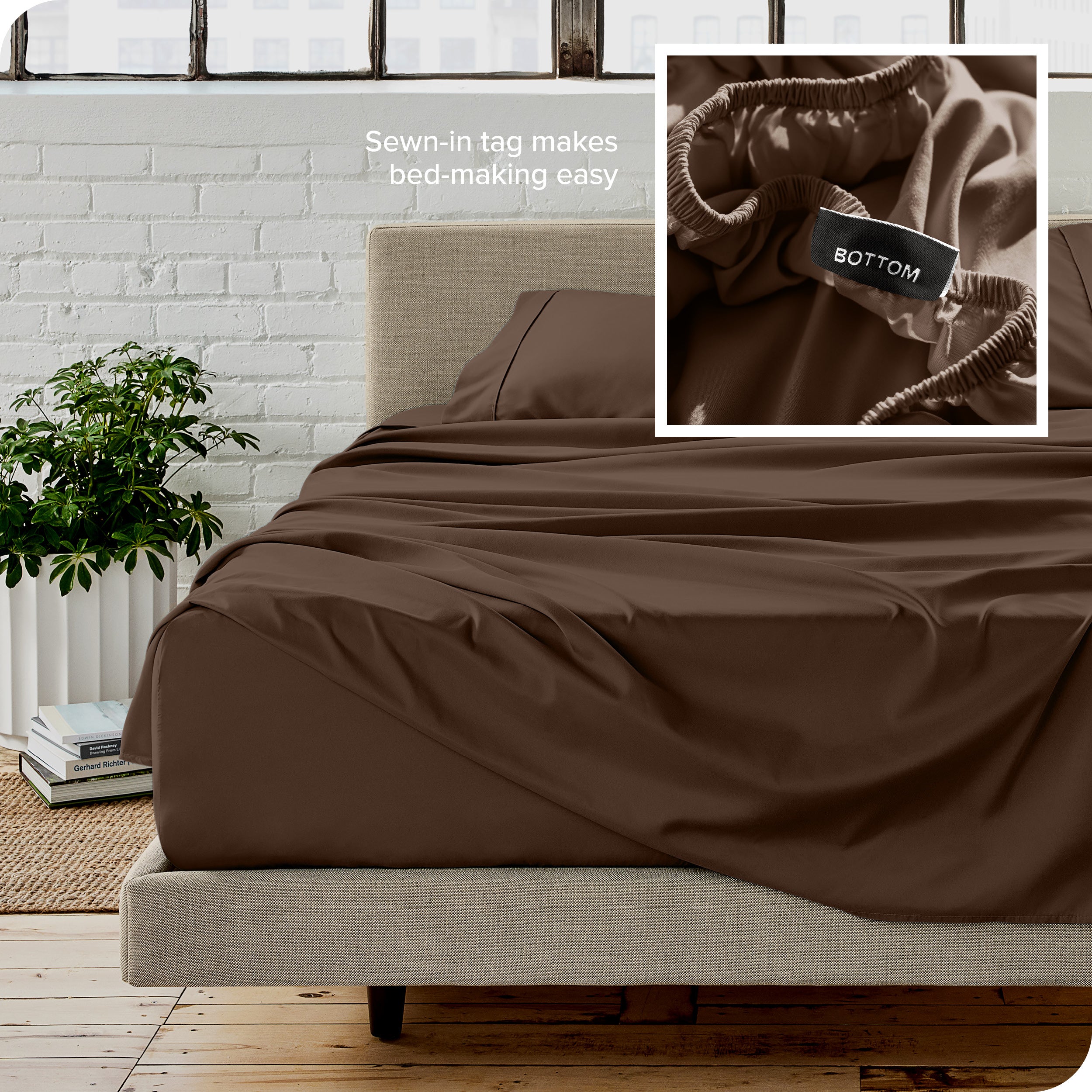 Close up of sewn in tag and matching sheets on a bed