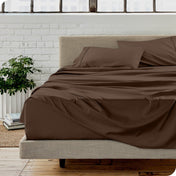 A modern bedroom with microfiber sheets on the mattress