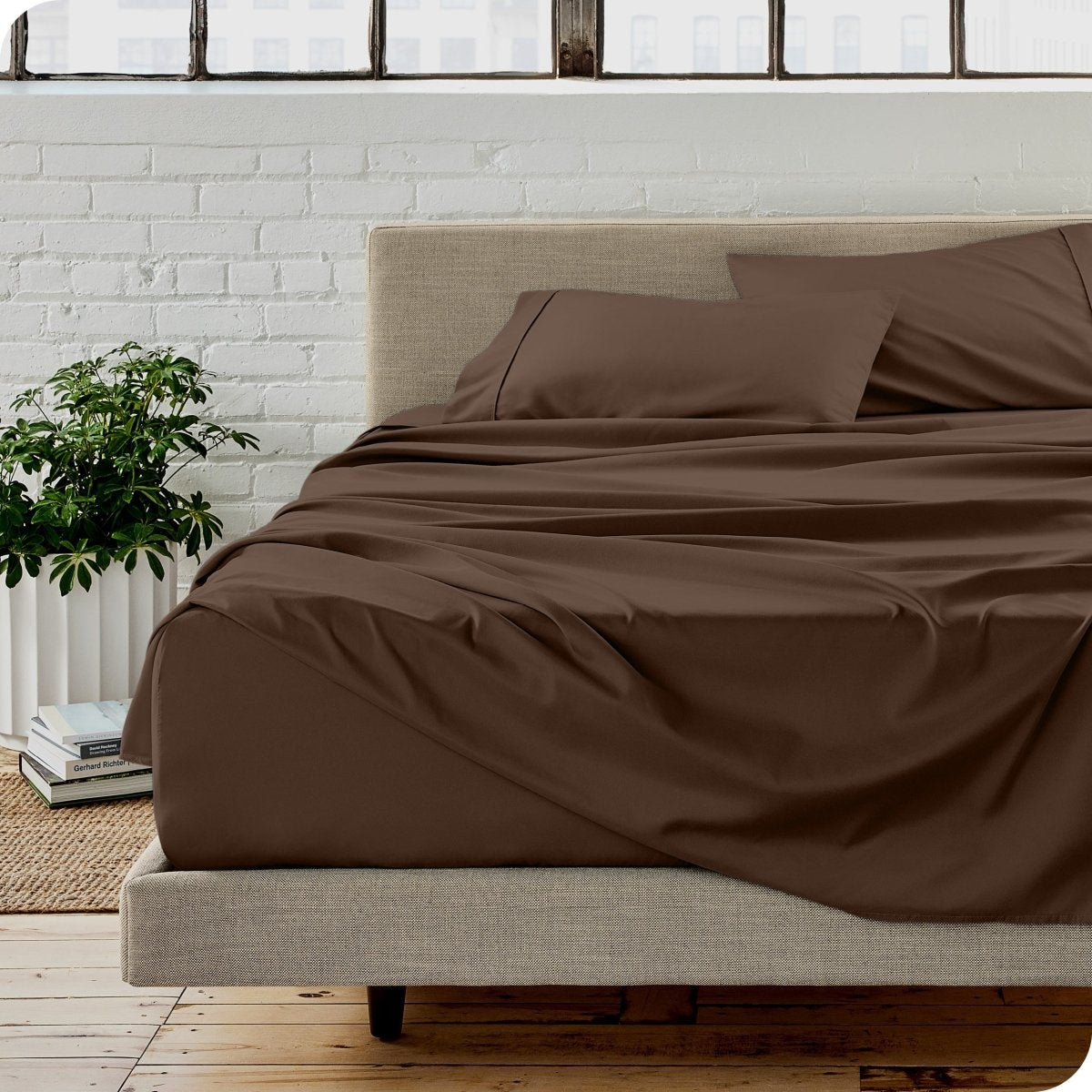 A modern bedroom with microfiber sheets on the mattress