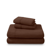 Polar fleece sheets and pillowcases folded and stacked on a white background
