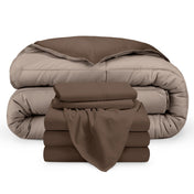 A reversible microfiber comforter and a coordinating sheet set folded and stacked