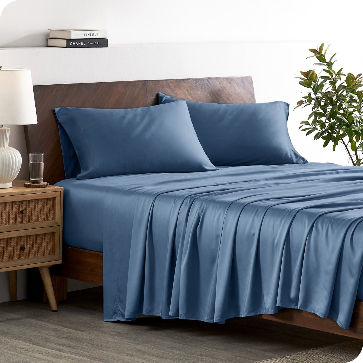 A stylish bed with bamboo sheets and pillowcases, showcasing a sophisticated and elegant bedroom setting.