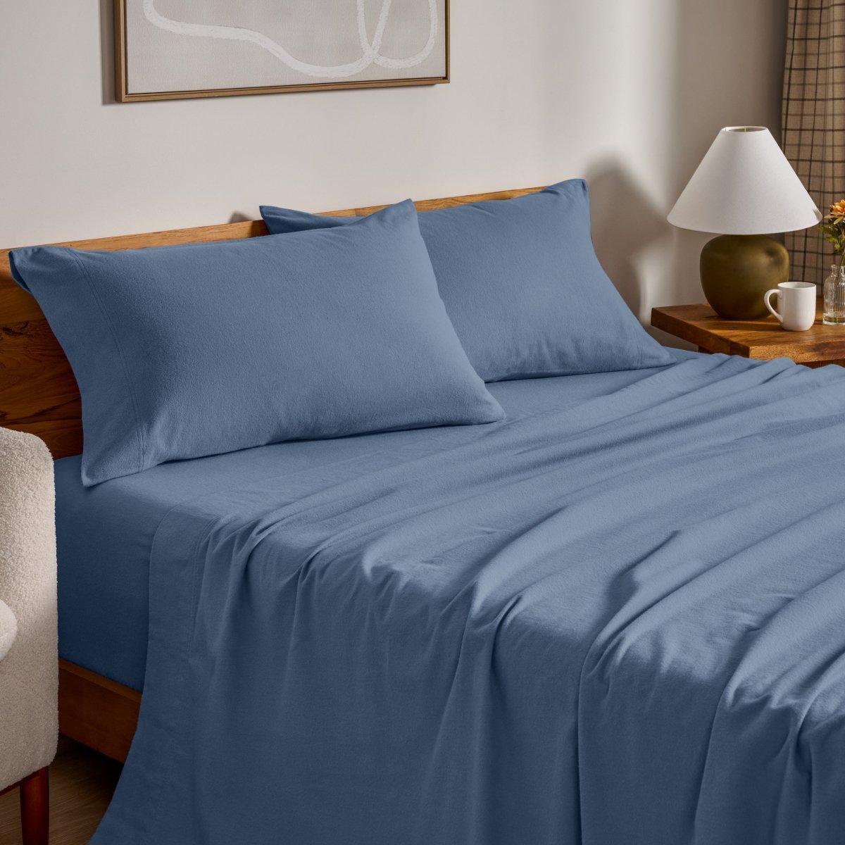 Flannel bed sheets and pillowcases on a bed in a bedroom setting.