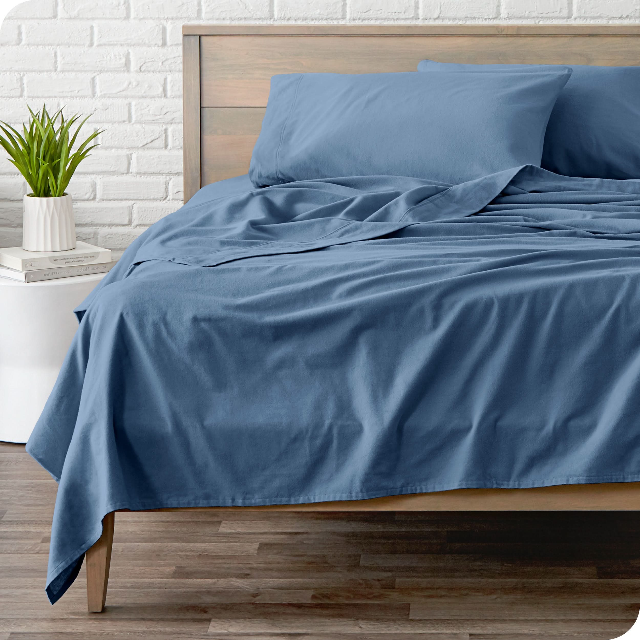 A modern bed with a flannel sheet set on