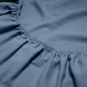 Close-up of a flannel fitted sheet with gathered elastic