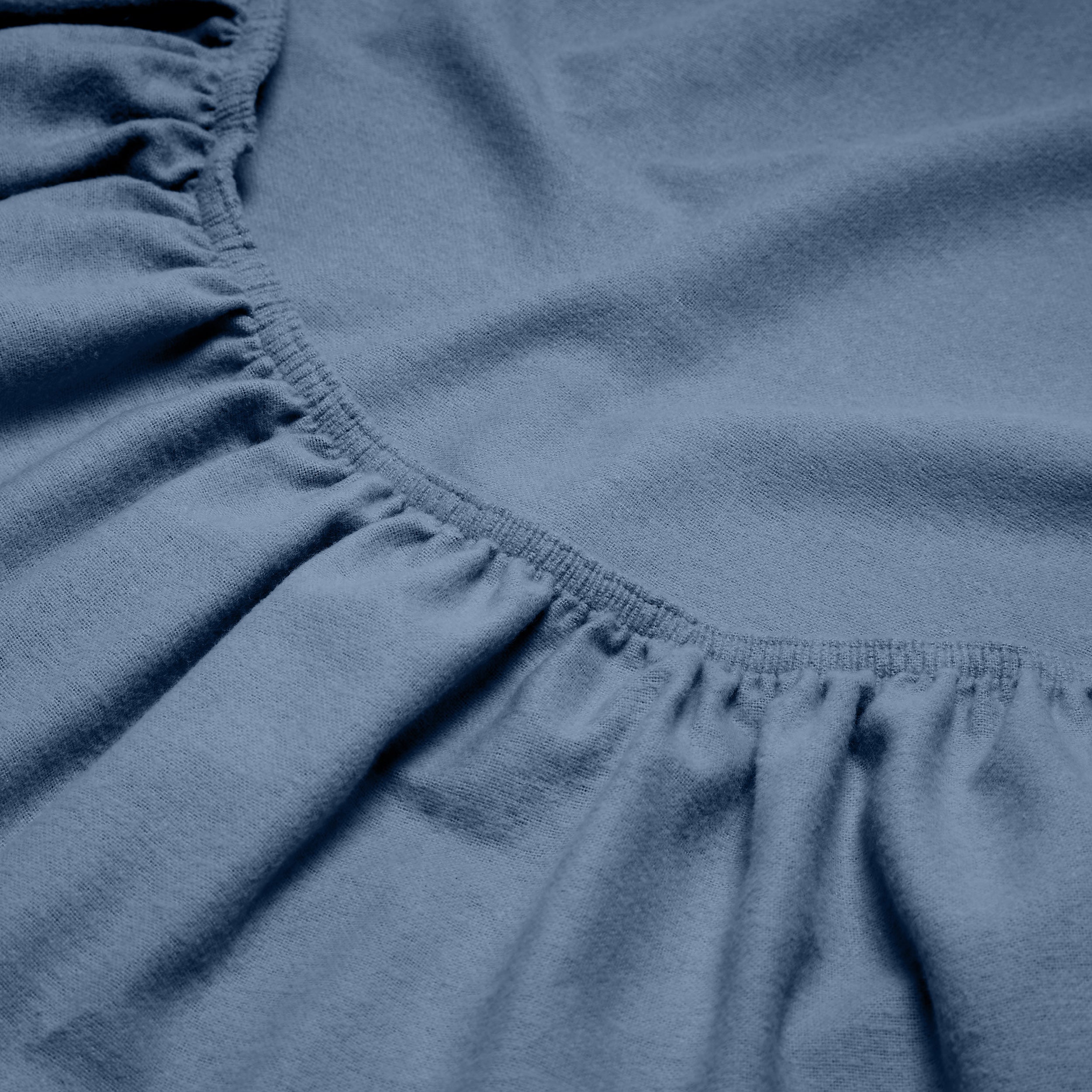 Close-up of a flannel fitted sheet with gathered elastic