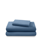 Cotton flannel sheet set folded and stacked on a white background