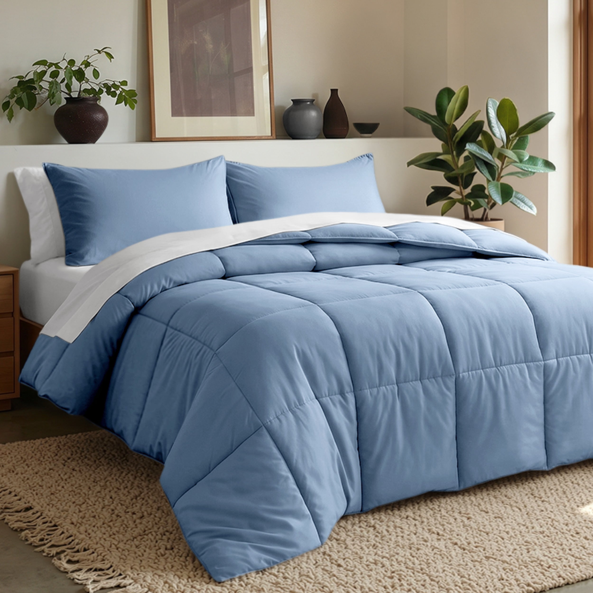 Comforter set on a bed in a bedroom with plants and decor.