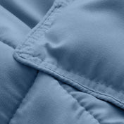 Close-up of comforter fabric with stitching detail