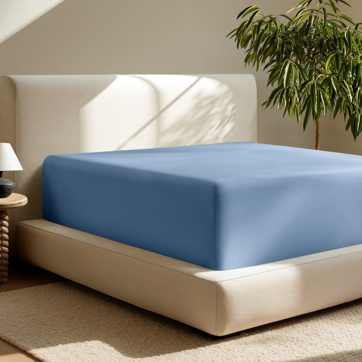 A deep pocket fitted sheet on a mattress