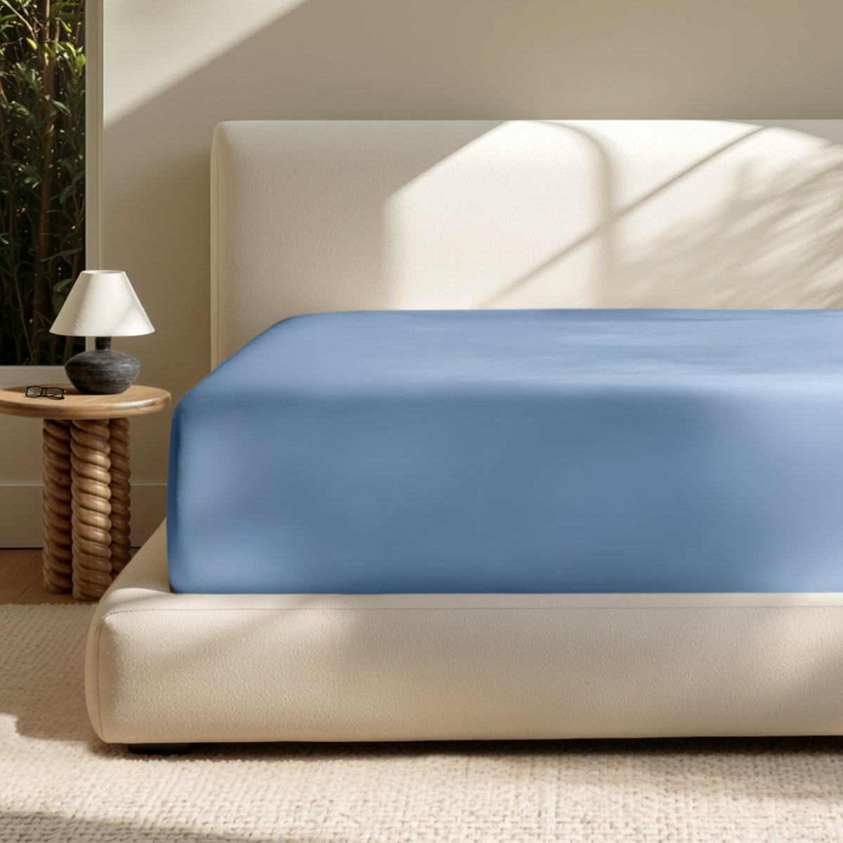 A deep pocket mattress with a fitted sheet on it