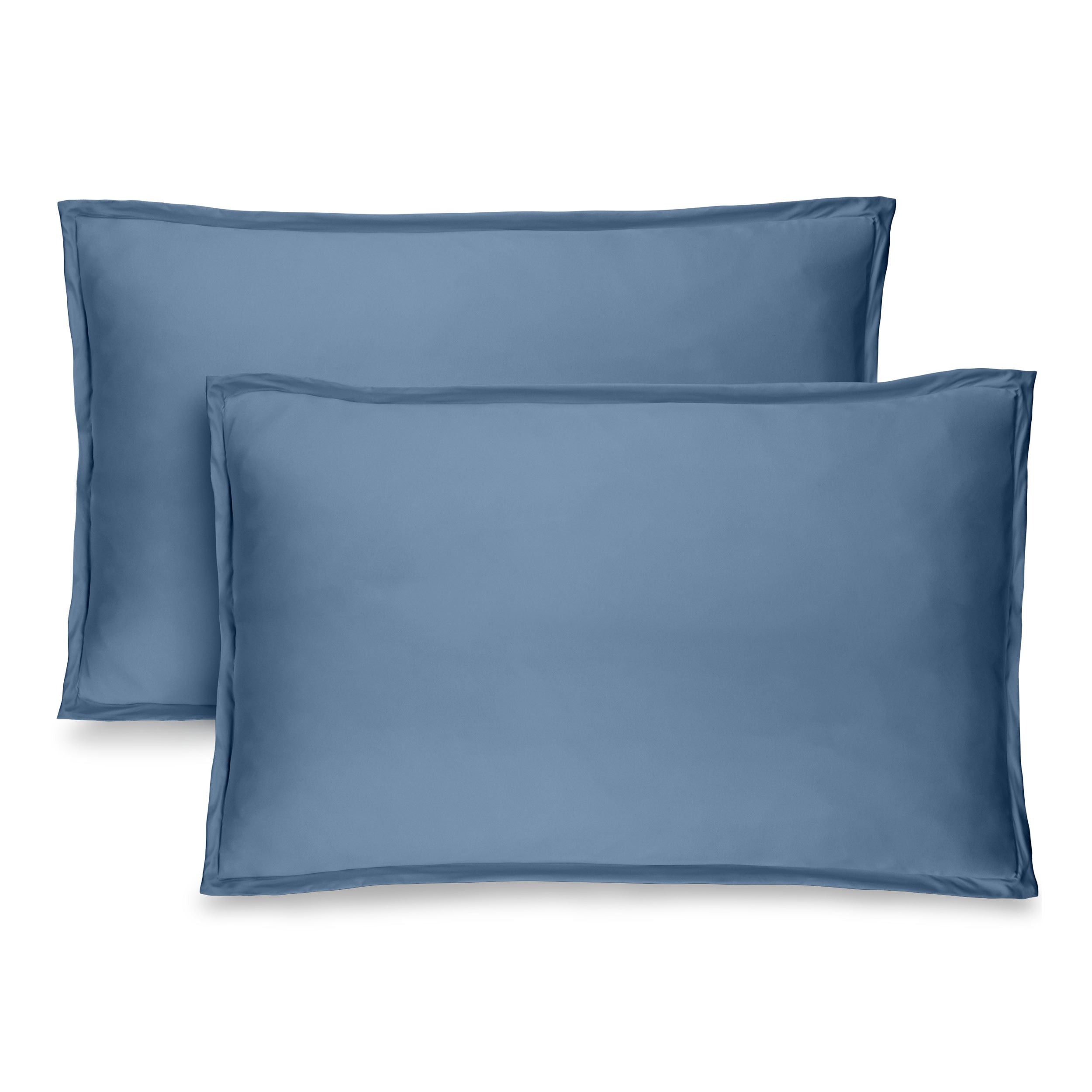 Two coronet blue pillow shams on pillows standing up with one behind the other