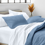 Close up of pillow shams on a bed
